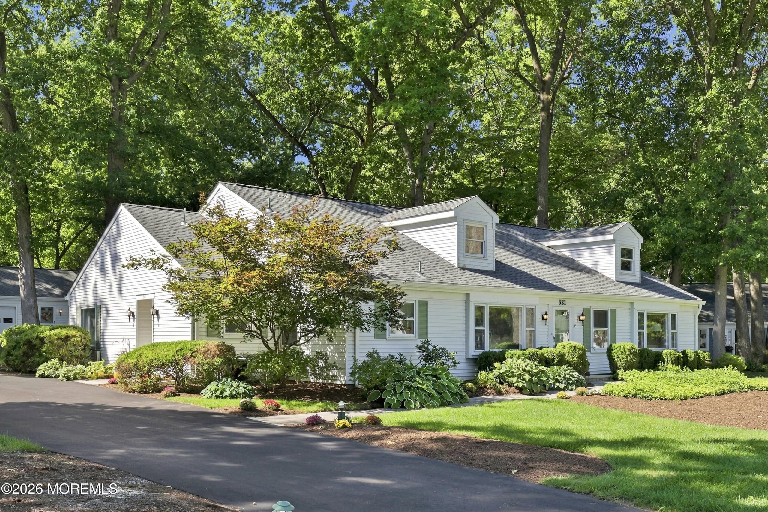 Almost one acre of privacy yet close to all of the community amenities, this location is prime!