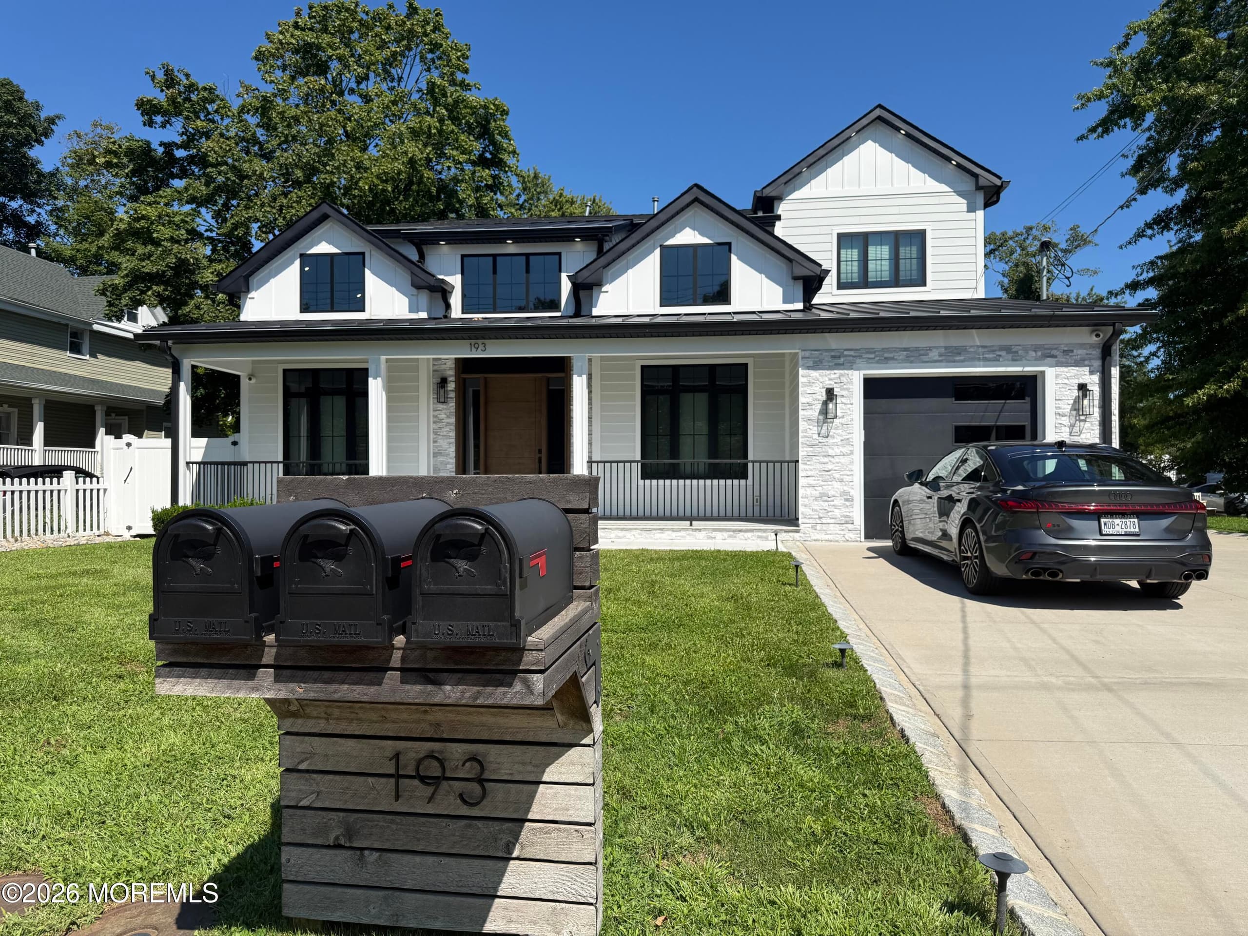 Rear of main prestigious home above garage upstairs apartment